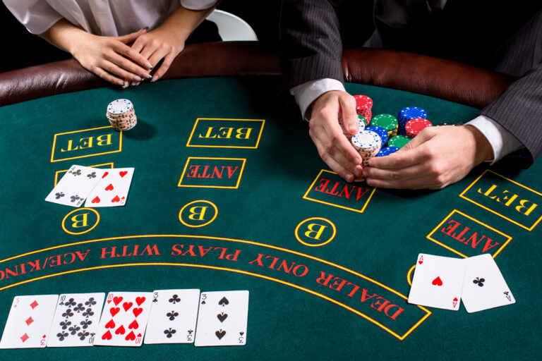 couple playing poker at the table